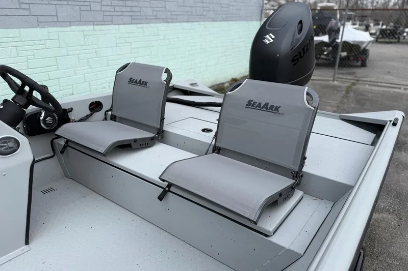 Slide: The Image of 2026 SeaArk Shadow 187 boat interior with dual seats and Suzuki engine. - 5