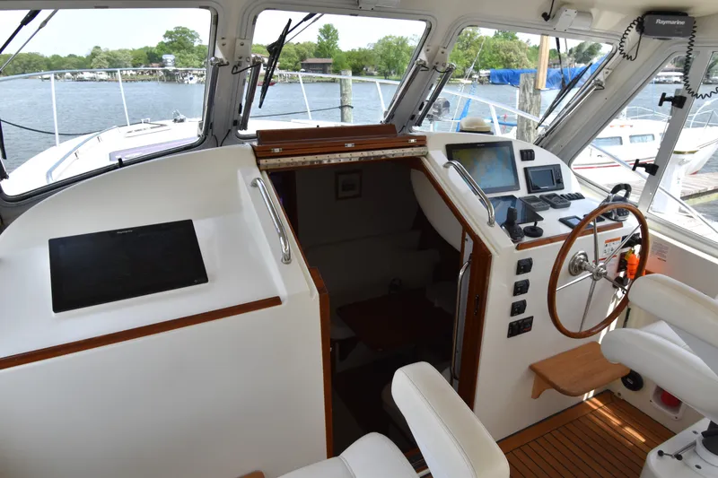 Slide: The Image of 2011 MJM 40z Downeast boat cockpit with navigation equipment and seating. - 15