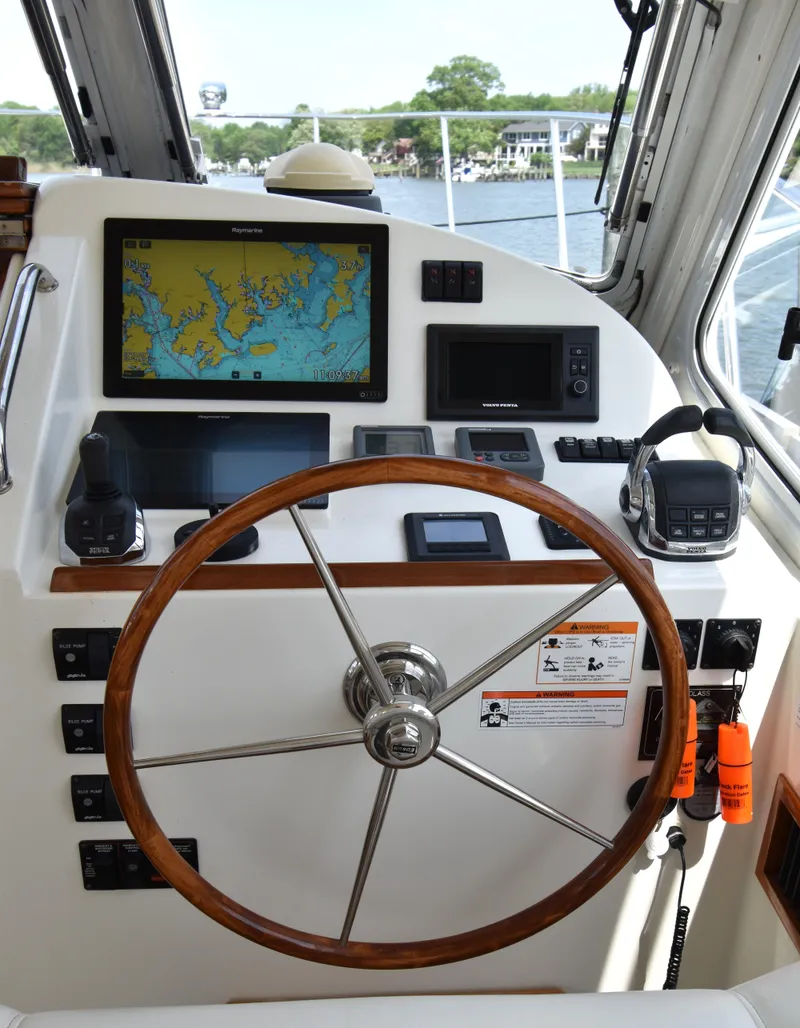 Slide: The Image of Helm of 2011 MJM 40z Downeast boat with navigation equipment and wooden steering wheel. - 16