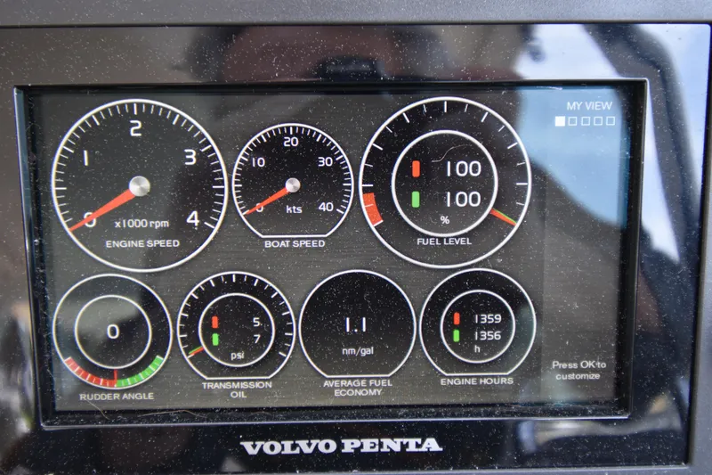 Slide: The Image of Dashboard of a 2011 MJM 40z Downeast boat showing engine and fuel metrics. - 18