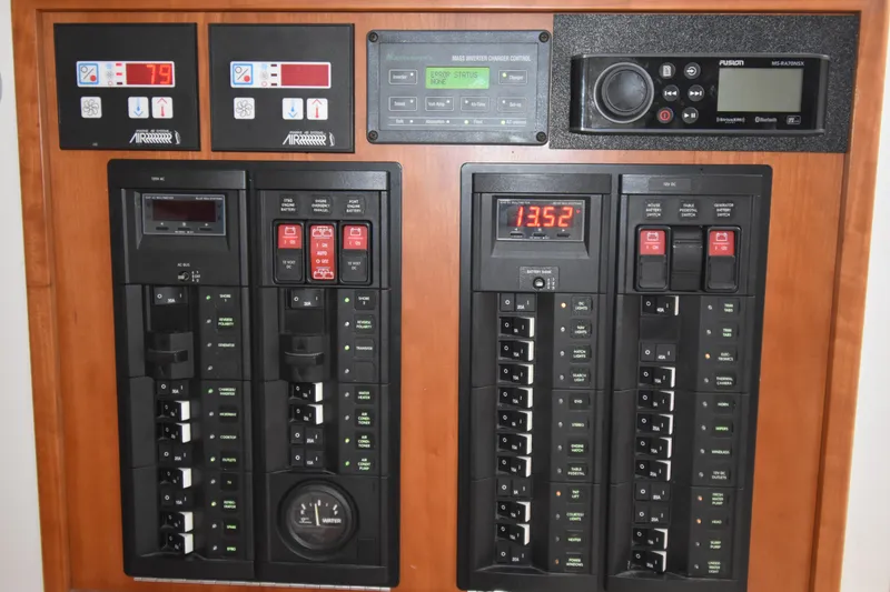 Slide: The Image of Control panel of a 2011 MJM 40z Downeast boat with various switches and displays. - 29