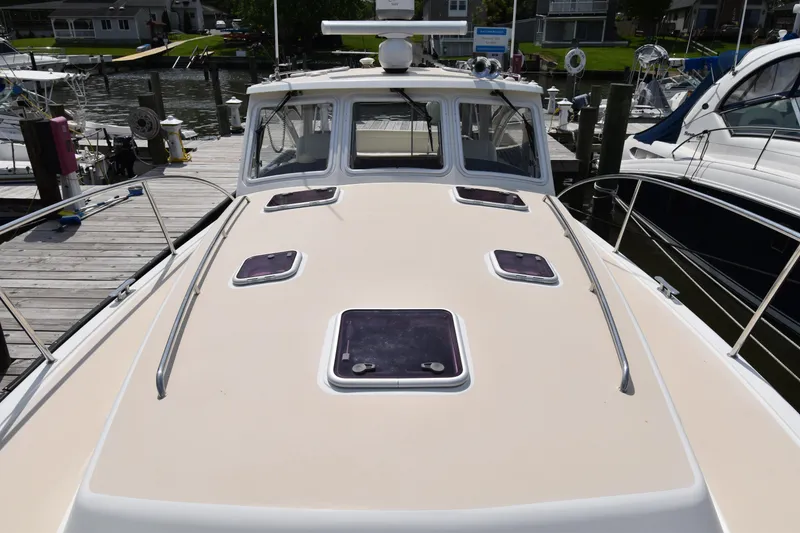 Slide: The Image of 2011 MJM 40z Downeast boat docked at a marina. - 8