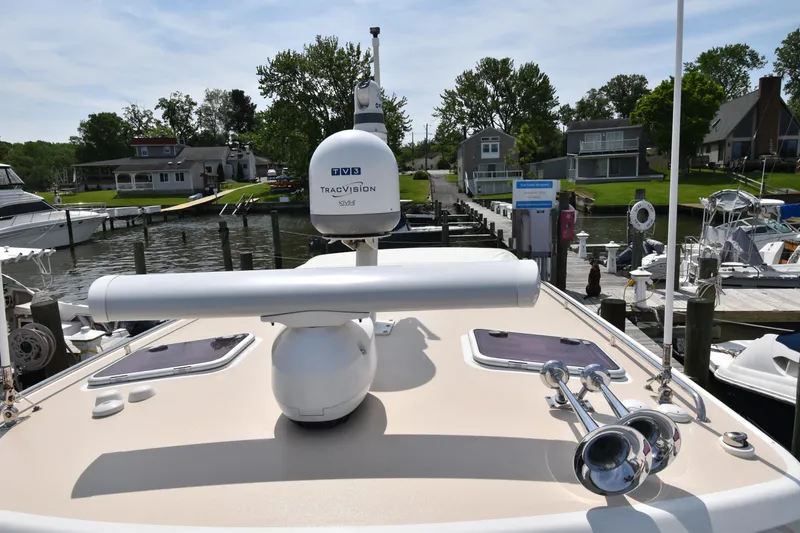Slide: The Image of 2011 MJM 40z Downeast boat docked at a marina with radar and horn. - 9