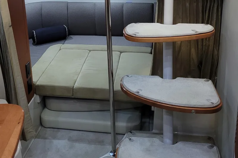 Slide: The Image of 2005 Chaparral Signature 310 interior with cozy seating and stylish staircase. - 12