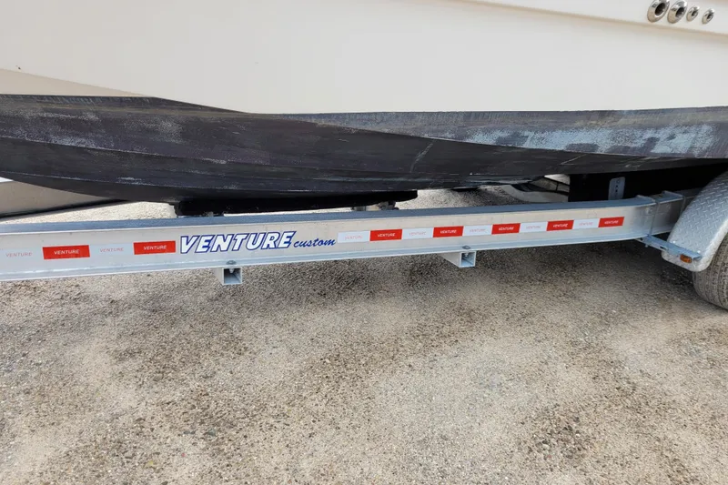 Slide: The Image of 2005 Chaparral Signature 310 on Venture Custom trailer, parked on gravel. - 17