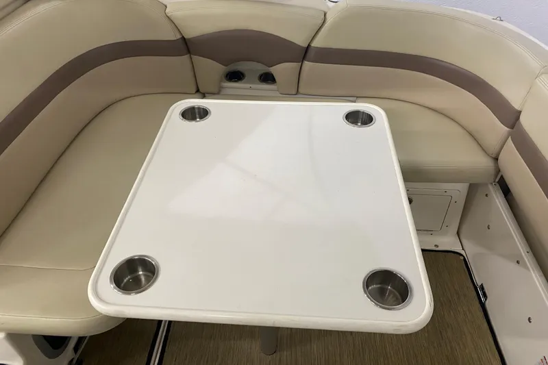 Slide: The Image of 2005 Chaparral Signature 310 boat interior with beige seating and table. - 7
