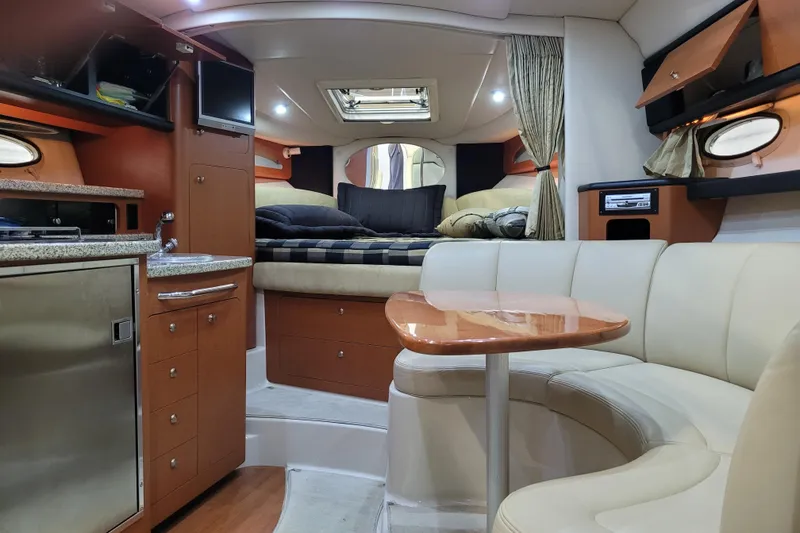 Slide: The Image of Interior of 2005 Chaparral Signature 310 yacht with cozy seating and modern amenities. - 8