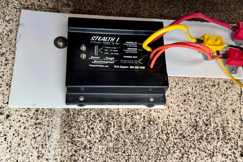 Slide: The Image of Stealth I battery charger in a 2017 Blazer Bay 2400 boat, featuring colorful wiring. - 12