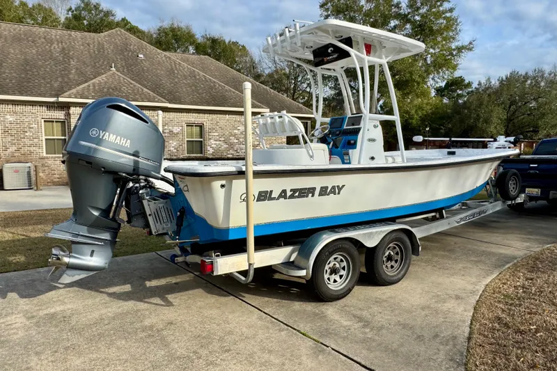 Slide: The Image of 2017 Blazer Bay 2400 boat on trailer with Yamaha outboard motor. - 3