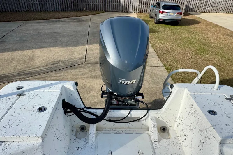 Slide: The Image of 2017 Blazer Bay 2400 boat with Yamaha 300 outboard motor in driveway. - 6