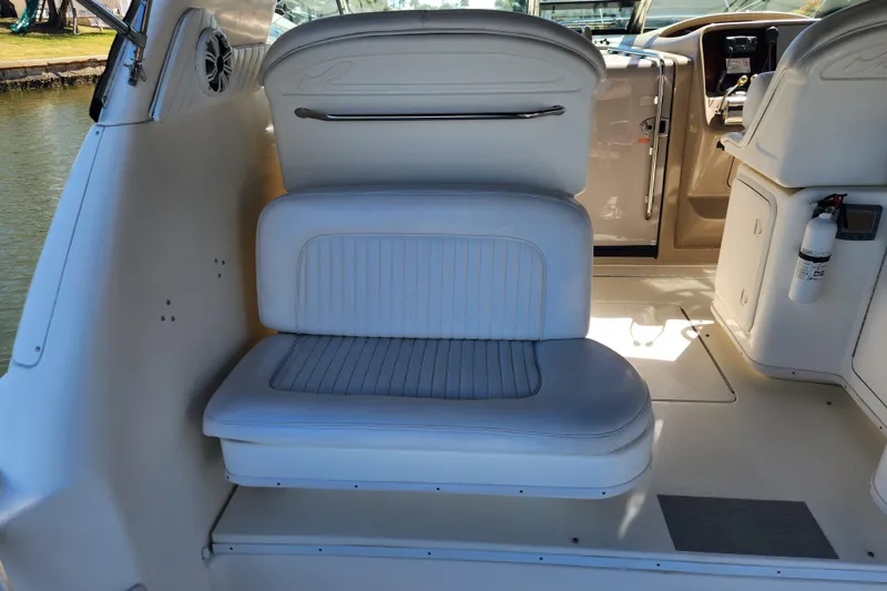 Slide: The Image of 2001 Sea Ray 340 Amberjack interior seating with white upholstery and cockpit view. - 21
