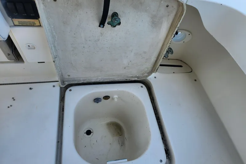 Slide: The Image of Open storage compartment on 2001 Sea Ray 340 Amberjack boat deck. - 27