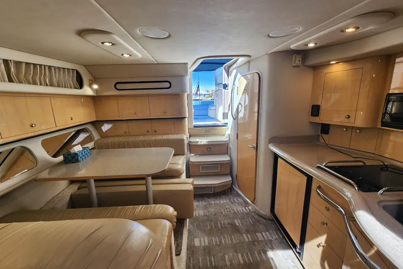 Slide: The Image of Interior of 2001 Sea Ray 340 Amberjack yacht with kitchen and dining area. - 30
