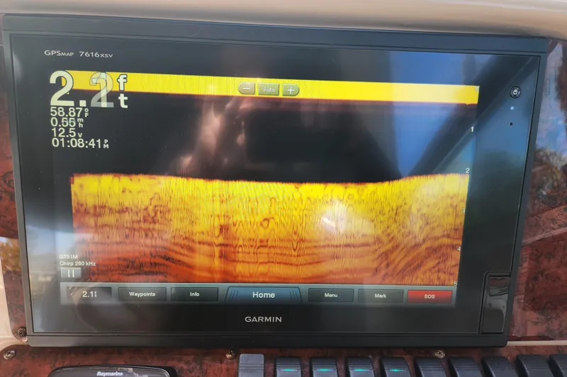 Slide: The Image of Garmin GPS display on 2001 Sea Ray 340 Amberjack showing depth and sonar data. - 42