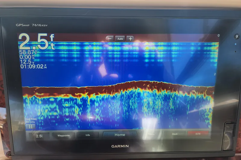 Slide: The Image of Garmin GPS display on 2001 Sea Ray 340 Amberjack, showing 2.5 feet depth reading. - 44