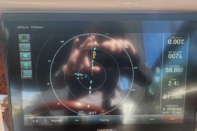 Slide: The Image of Garmin GPS display on 2001 Sea Ray 340 Amberjack, showing navigation and environmental data. - 45