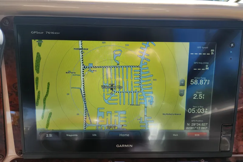 Slide: The Image of Garmin GPS display on 2001 Sea Ray 340 Amberjack, showing navigation map and data. - 48
