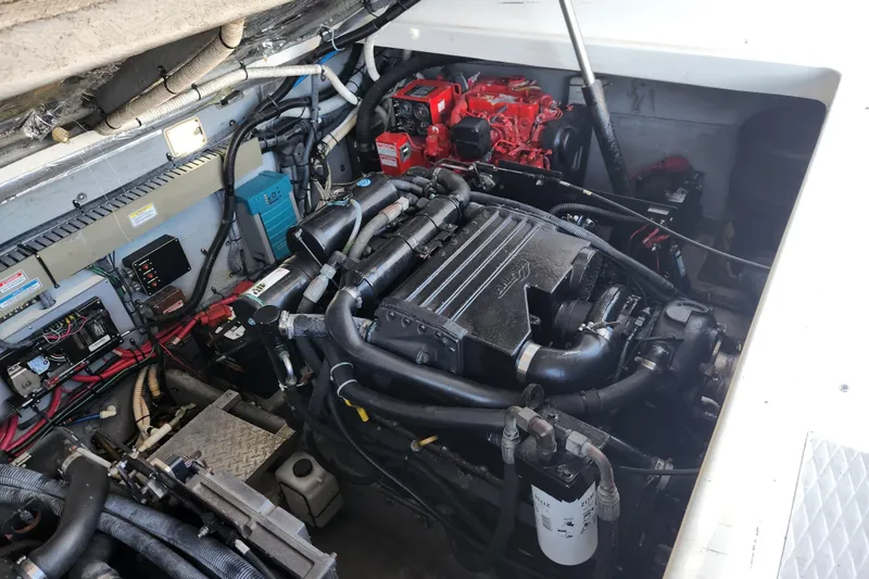 Slide: The Image of Engine compartment of a 2001 Sea Ray 340 Amberjack boat, showcasing mechanical components. - 51