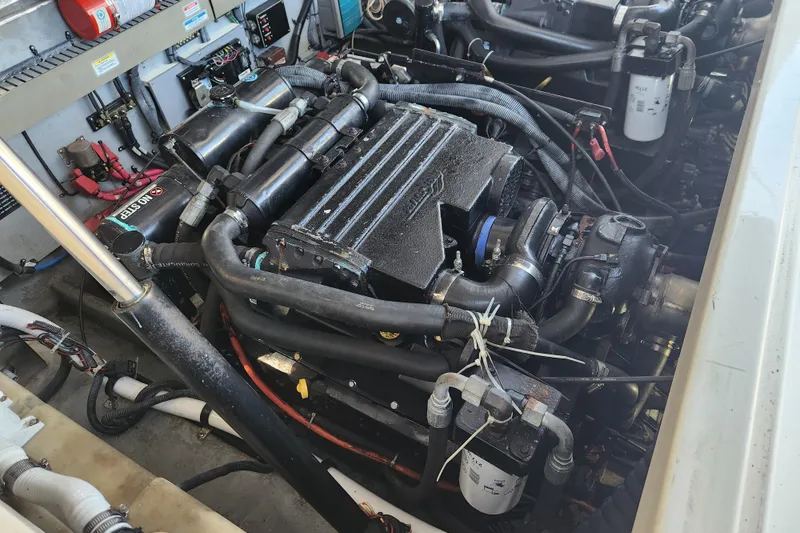 Slide: The Image of Engine compartment of a 2001 Sea Ray 340 Amberjack boat, showcasing detailed components. - 53