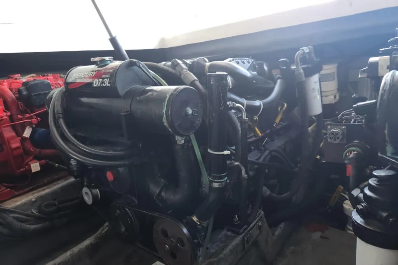 Slide: The Image of Engine compartment of a 2001 Sea Ray 340 Amberjack with Mercury MerCruiser 7.3L diesel engine. - 58