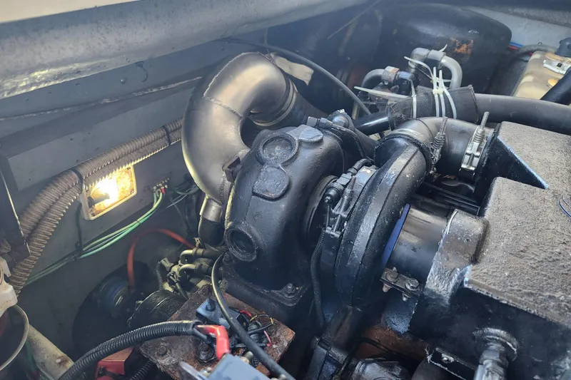 Slide: The Image of Engine compartment of a 2001 Sea Ray 340 Amberjack boat, showing mechanical components. - 59