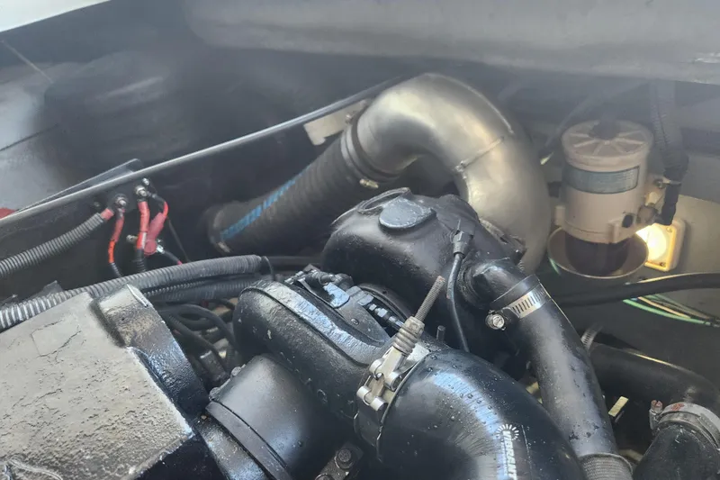 Slide: The Image of Engine compartment of a 2001 Sea Ray 340 Amberjack boat, showing hoses and components. - 60