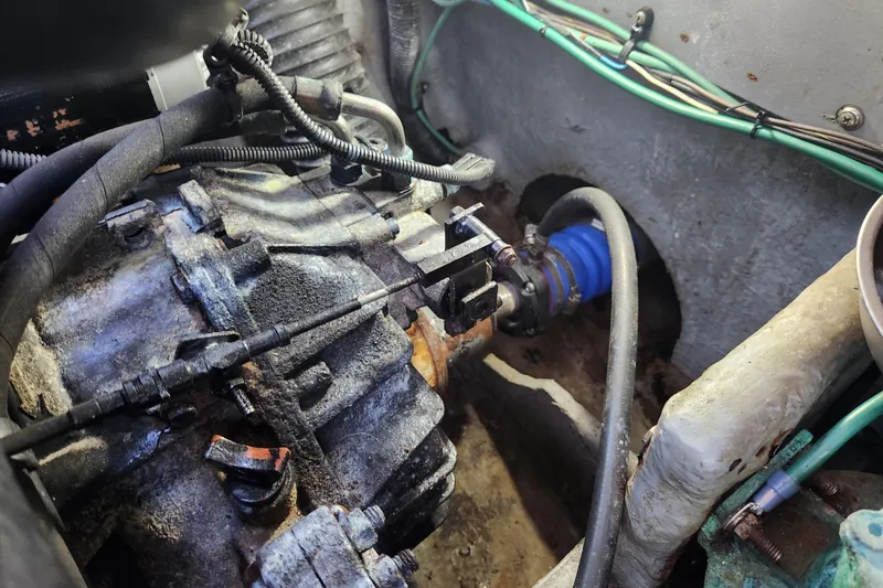 Slide: The Image of Engine compartment of a 2001 Sea Ray 340 Amberjack boat, showing mechanical components. - 62