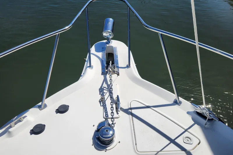 Slide: The Image of Bow of 2001 Sea Ray 340 Amberjack with anchor chain and railing. - 8