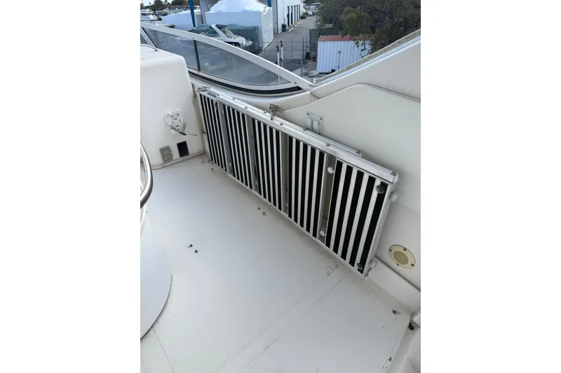 Slide: The Image of 2001 Sea Ray 560 Sedan Bridge boarding ladder. - 12