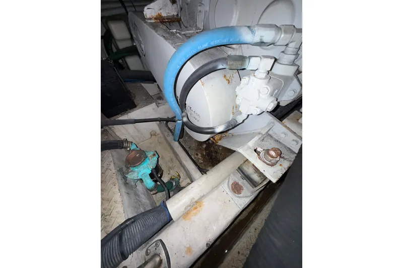 Slide: The Image of Engine room of 2001 Sea Ray 560 Sedan Bridge with CAT marine power components. - 30