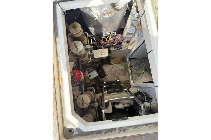 Slide: The Image of Engine room of 2001 Sea Ray 560 Sedan Bridge with visible mechanical components. - 34