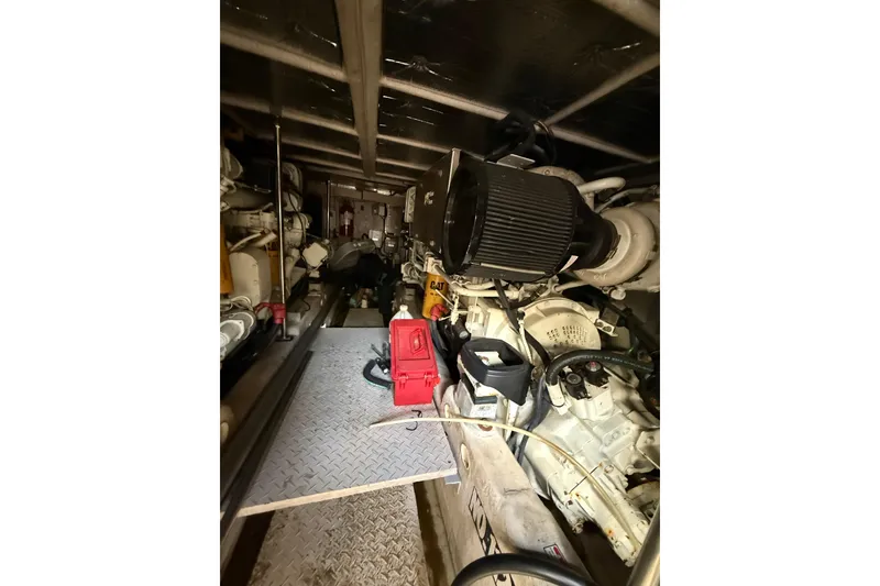 Slide: The Image of Engine room of a 2001 Sea Ray 560 Sedan Bridge yacht, showing mechanical components. - 39