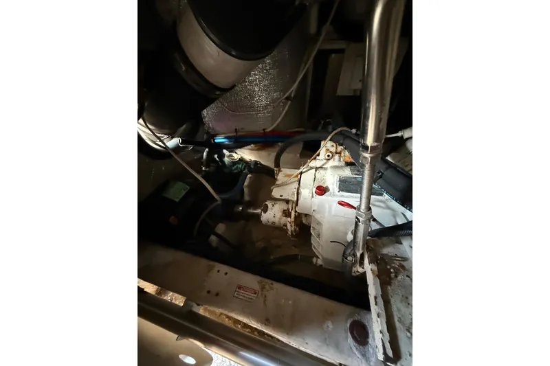 Slide: The Image of Engine room of 2001 Sea Ray 560 Sedan Bridge yacht, showcasing mechanical components. - 40