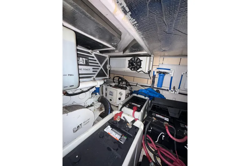 Slide: The Image of Engine room of a 2001 Sea Ray 560 Sedan Bridge yacht, showcasing mechanical components. - 44