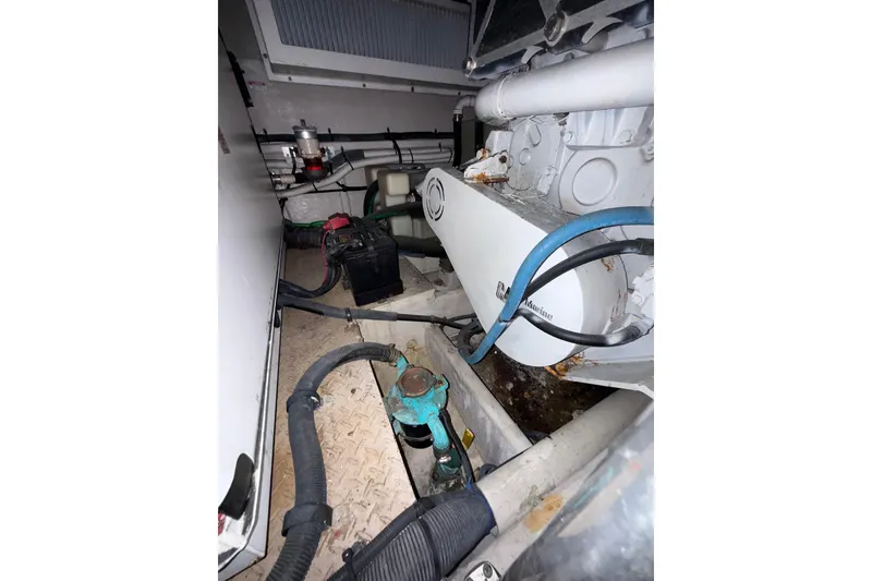 Slide: The Image of Engine room of 2001 Sea Ray 560 Sedan Bridge with Westerbeke generator. - 47