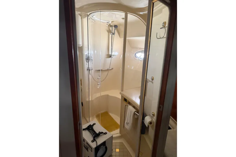 Slide: The Image of Engine room of 2001 Sea Ray 560 Sedan Bridge with visible components and wiring. - 48