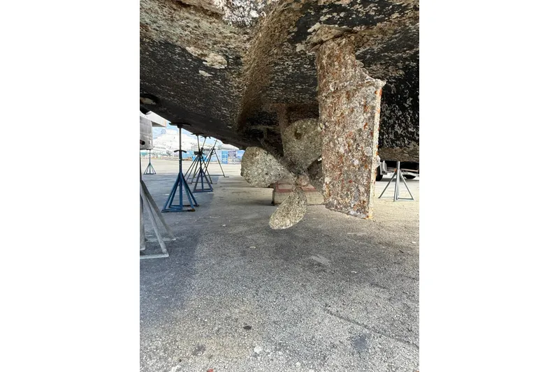 Slide: The Image of 2001 Sea Ray 560 Sedan Bridge propeller and hull on dry dock. - 7