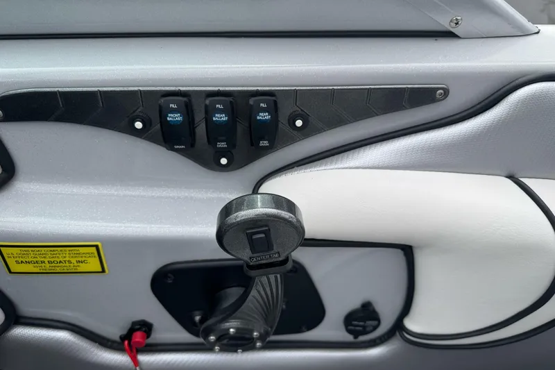 Slide: The Image of Control panel of 2024 Sanger 215 S boat with ballast switches and throttle. - 10