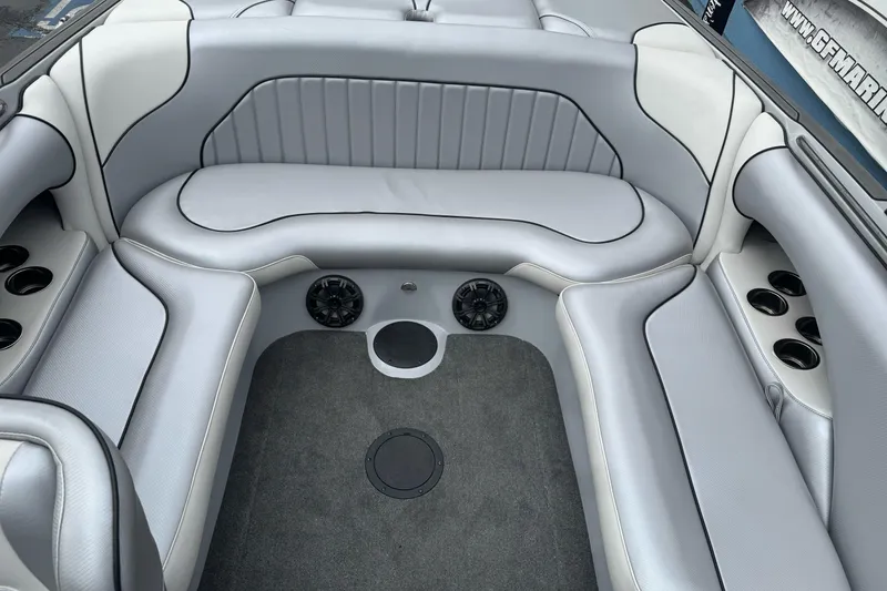Slide: The Image of 2024 Sanger 215 S boat interior with gray seating and cup holders. - 12