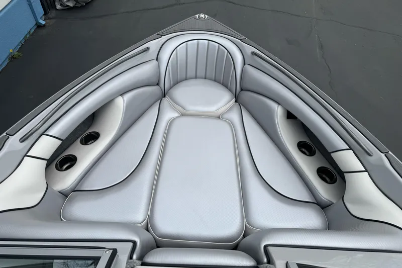 Slide: The Image of 2024 Sanger 215 S boat interior with sleek gray seating and cup holders. - 16