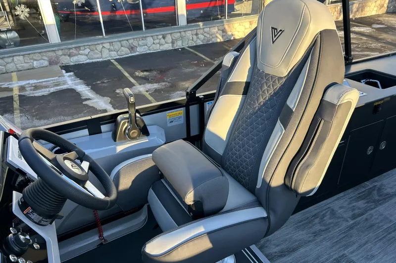 Slide: The Image of Captain's seat and controls of 2026 Viaggio Lago Z-B 22 boat, featuring modern design. - 11