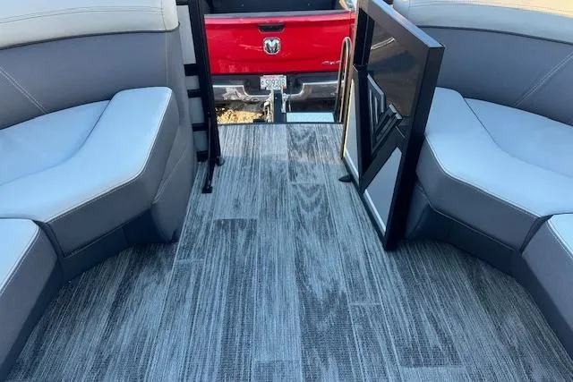 Slide: The Image of 2026 Viaggio Lago Z-B 22 boat interior with gray seating and wood-style flooring. - 21