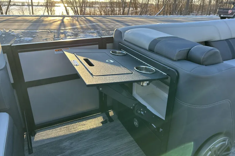 Slide: The Image of 2026 Viaggio Lago Z-B 22 boat interior with foldable table and cup holders. - 25