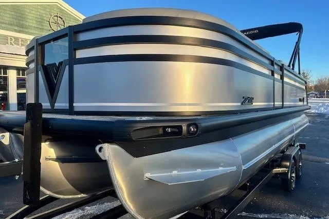 Slide: The Image of 2026 Viaggio Lago Z-B 22 pontoon boat with sleek silver design on trailer. - 3