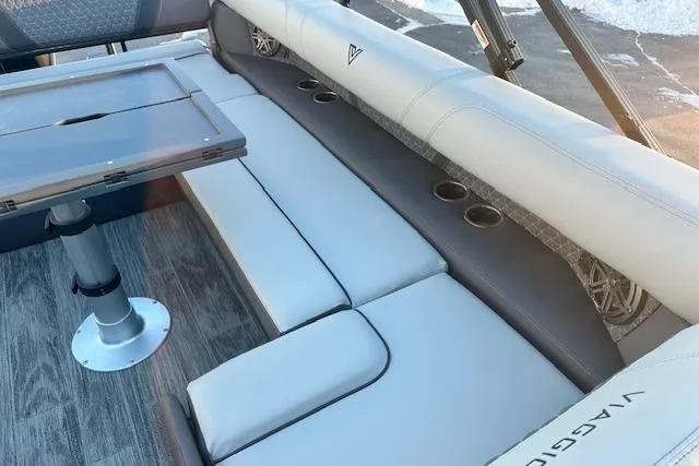 Slide: The Image of Luxurious seating area in 2026 Viaggio Lago Z-B 22 boat with table and cup holders. - 30