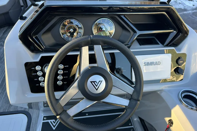 Slide: The Image of 2026 Viaggio Lago Z-B 22 dashboard with steering wheel and Simrad display. - 7