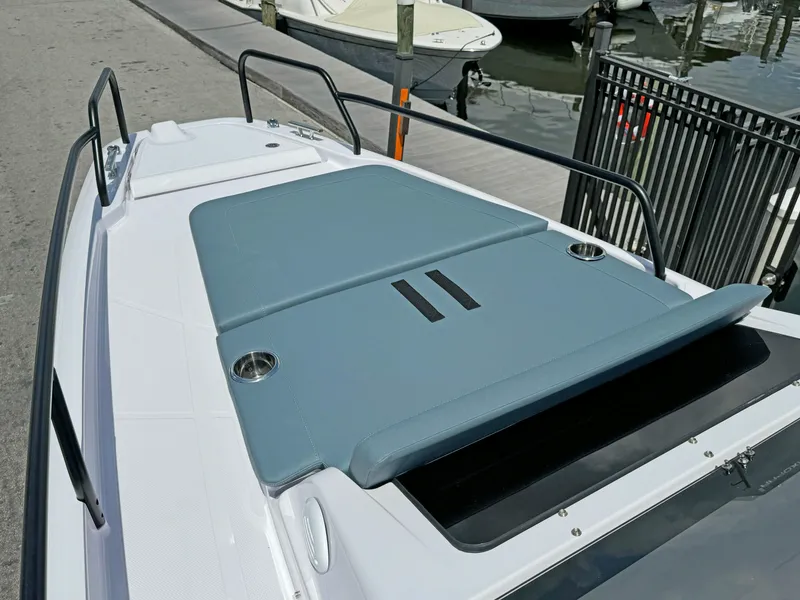 Slide: The Image of 2025 Axopar 25 Cross Top boat with sleek deck design and comfortable seating. - 11
