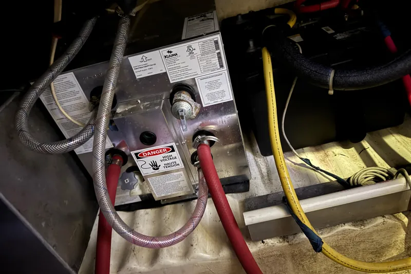 Slide: The Image of Electrical system inside 1988 Blue Seas 31 boat, featuring wiring and warning labels. - 30