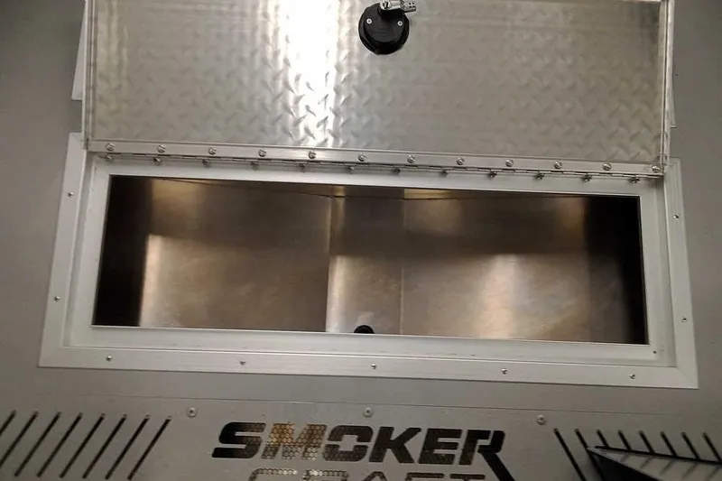 Slide: The Image of Open storage compartment on 2026 Smoker Craft Phantom 20 X2 boat. - 13