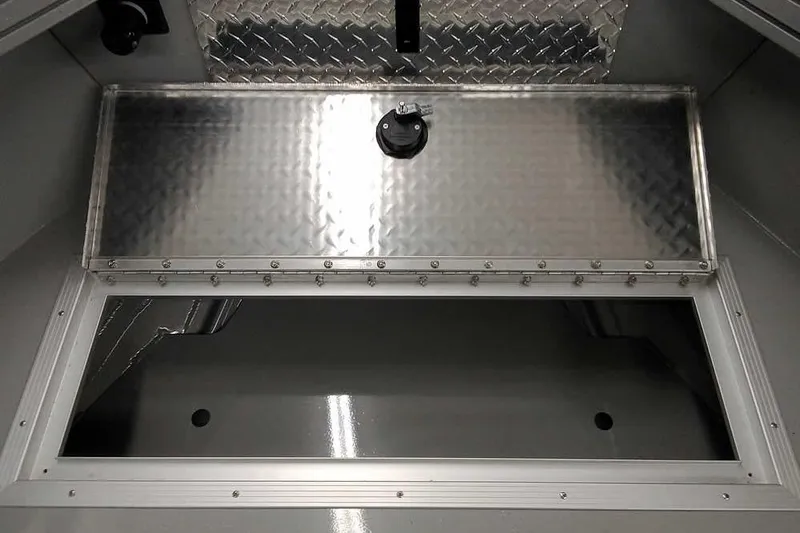 Slide: The Image of 2026 Smoker Craft Phantom 20 X2 boat storage compartment with metal lid and latch. - 14